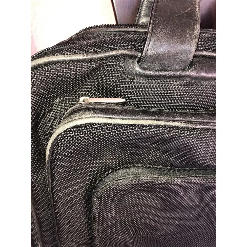 Tumi expandable leather
